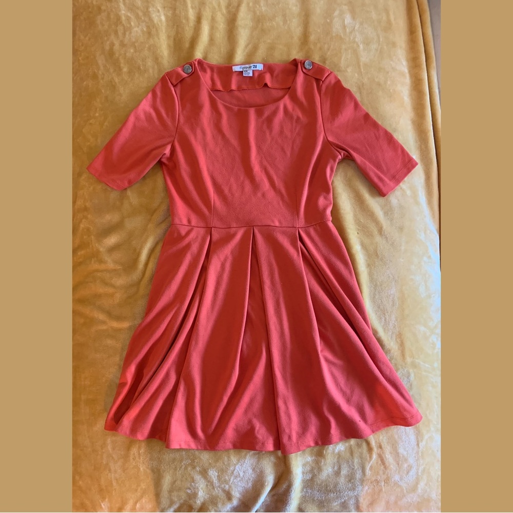 Orange pleated dress by H&M.